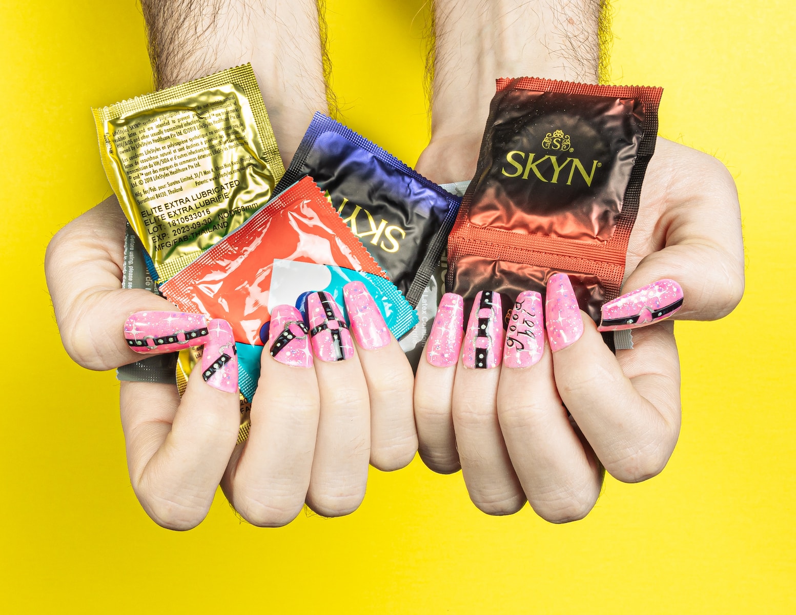 a person holding three different types of candy in their hands